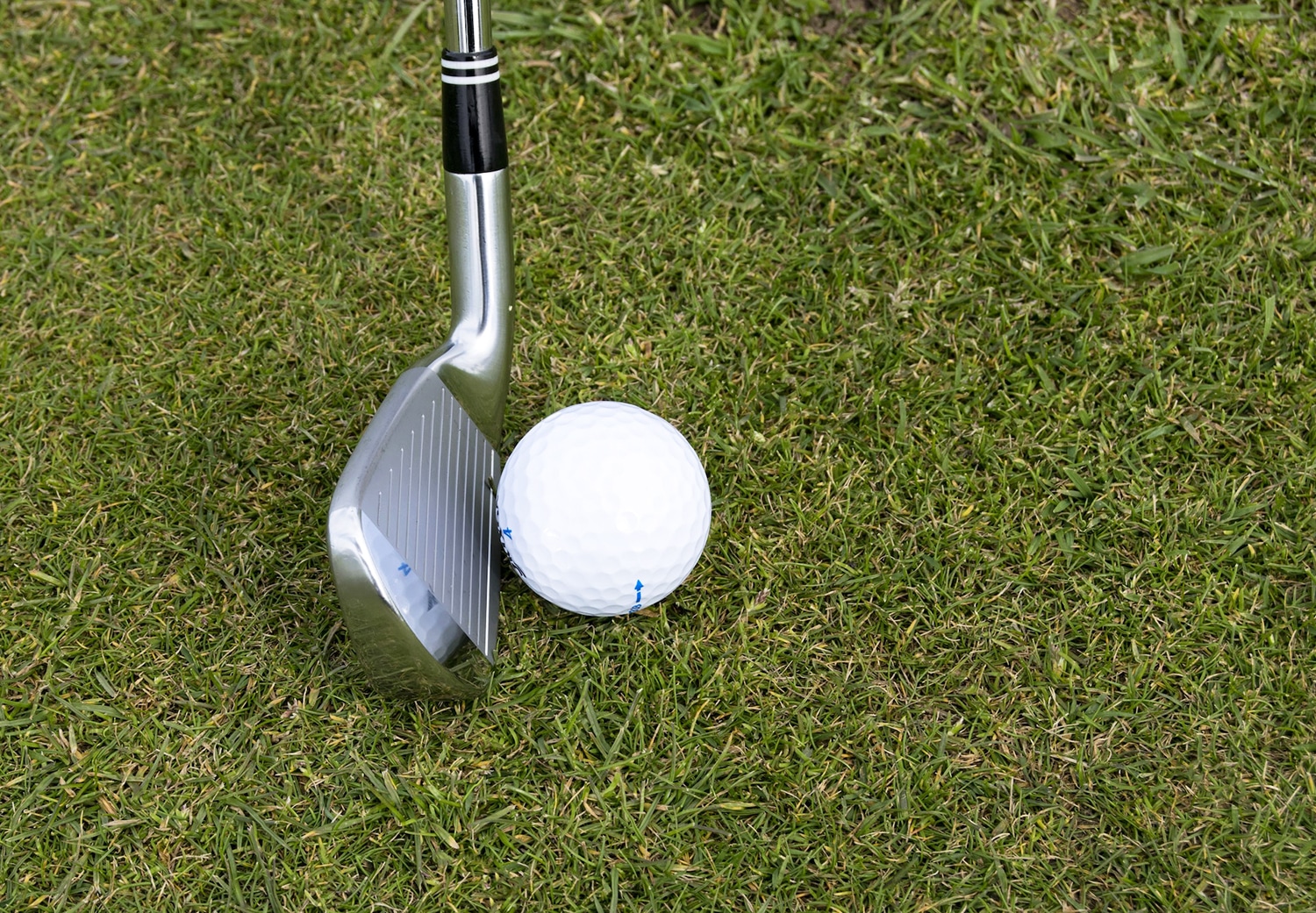 horizontal photo of a golf club and golf ball on a grass golf course. Image Pexels https://www.pexels.com/photo/activity-club-course-golf-274133/