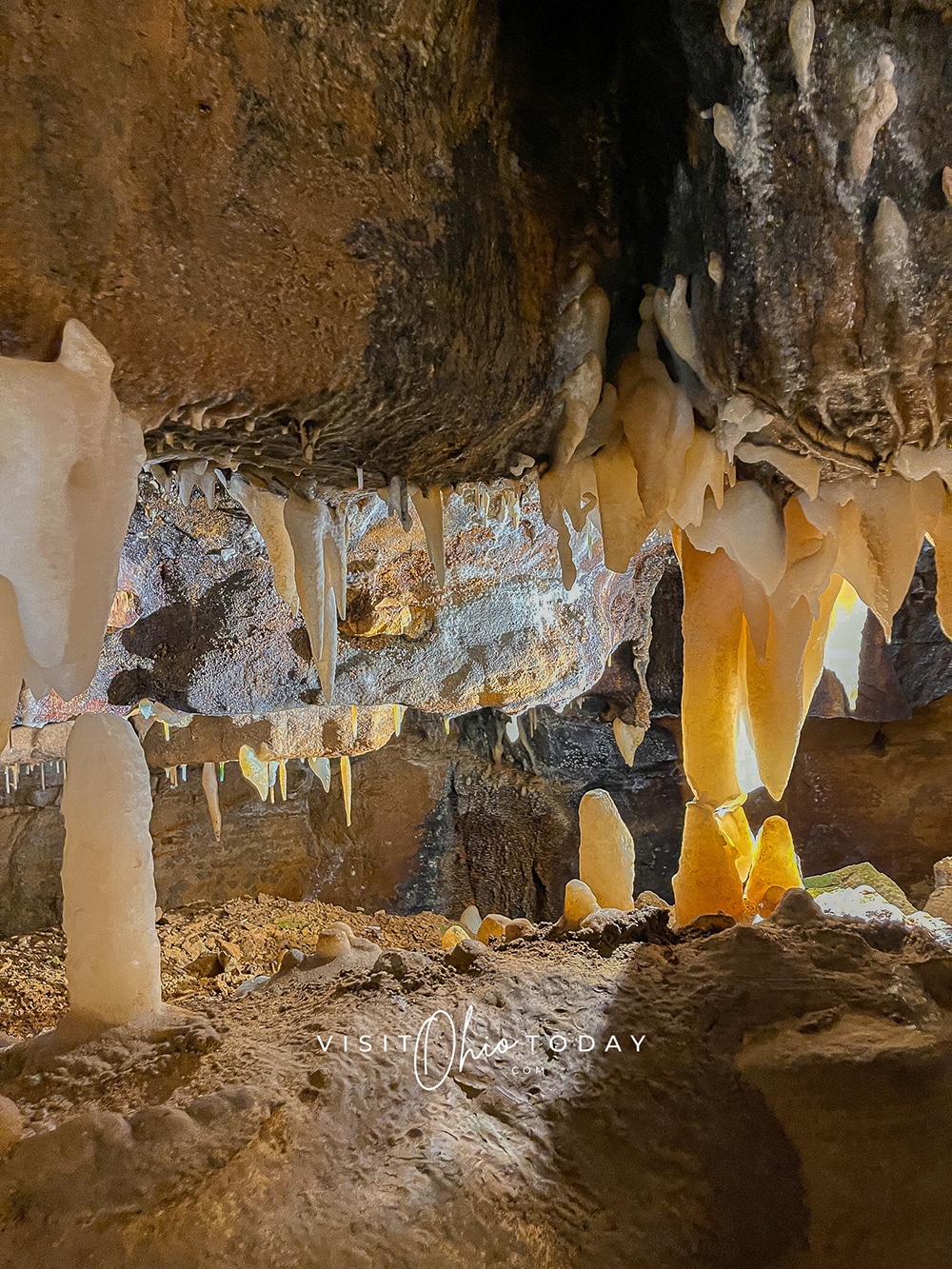 vertical photo of large stalactites and stalagmites in the ohio caverns