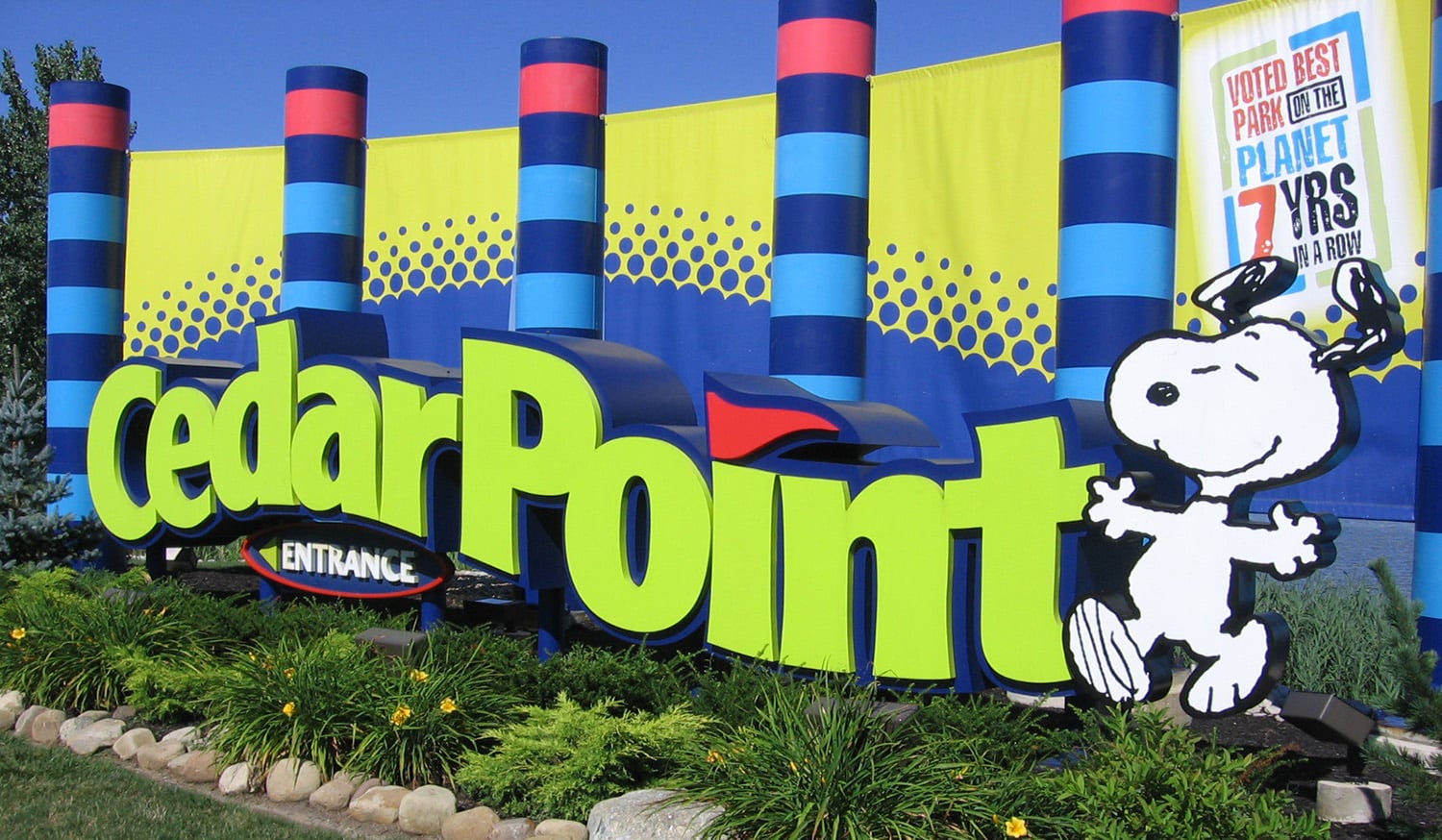 horizontal photo of the entrance of Cedar Point with the character Snoopy at the end of the word Cedar Point. Image is in the Public Domain