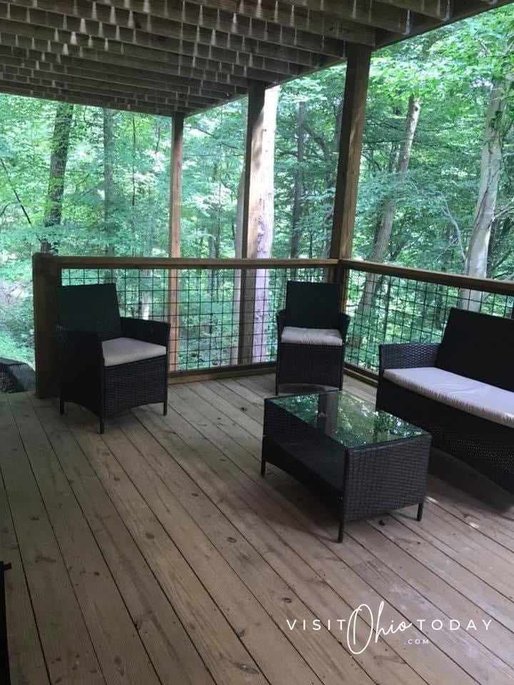 outside lower deck with ceiling above and wooden plans for floor and 3 chairs Photo credit: Cindy Gordon of VisitOhioToday.com