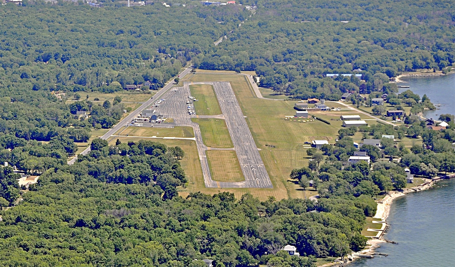 horizontal photo of an aerial shot of the put in bay airport and surrounding areas. Image via Canva pro license