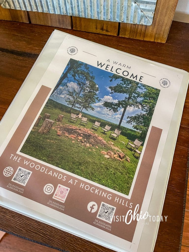 photos of welcome book at woodlands lodge picture of woodland lodge with blue sky above, photo credit cindy gordon of visitohiotoday