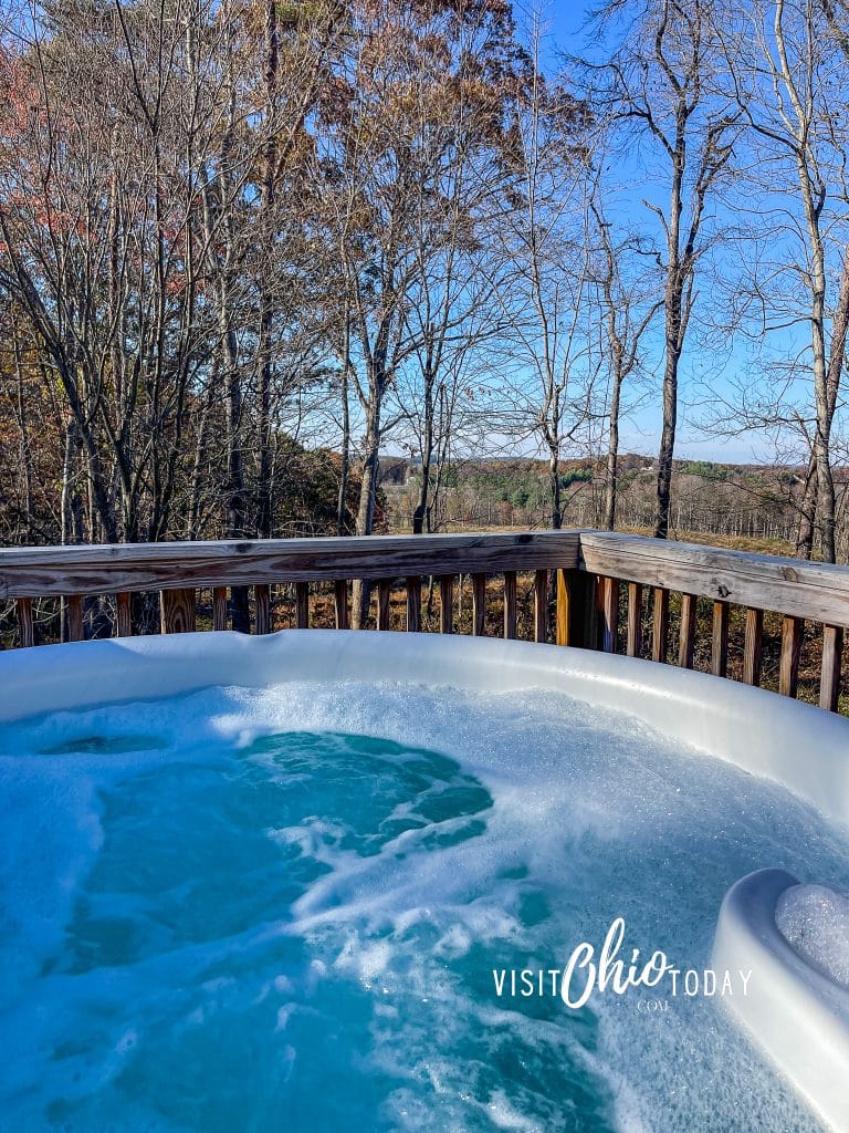 view of hottub water and bubbles and woods in the background Photo Credit Cindy Gordon of VisitOhioToday.com