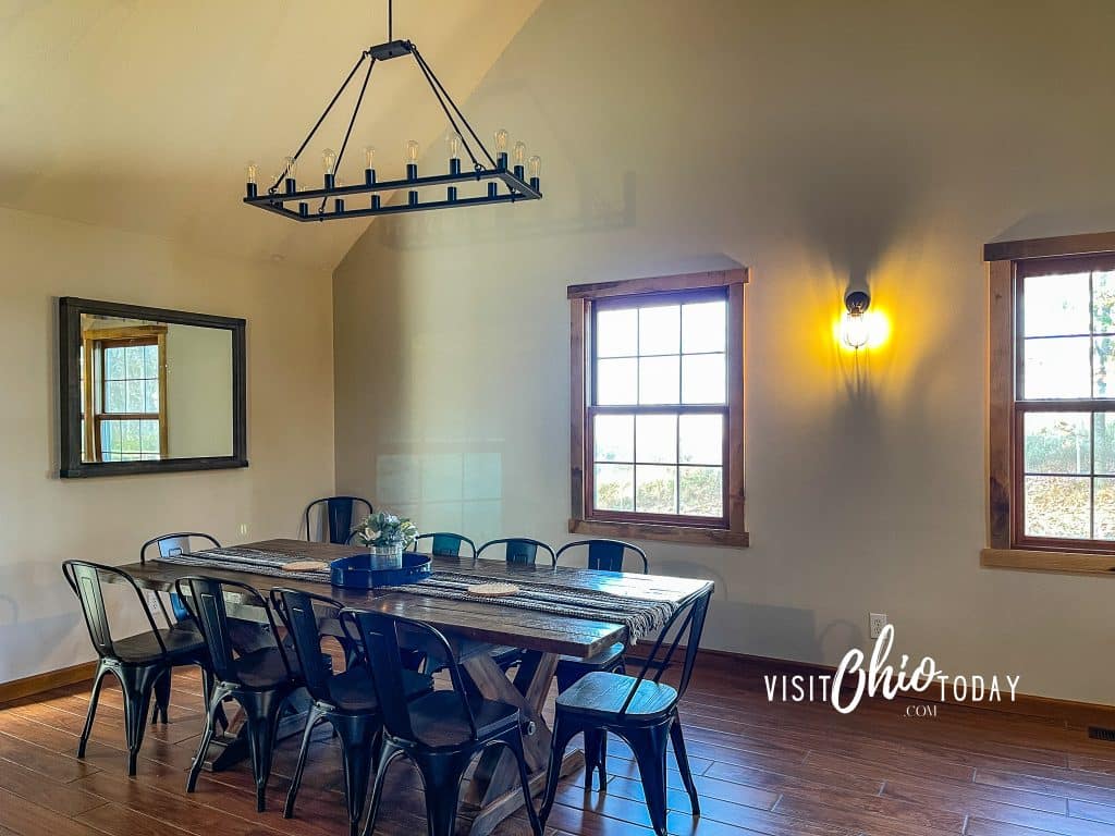 long large table, wooden with black metal chairs and black. metal light on the high ceiling above Photo Credit Cindy Gordon of VisitOhioToday.com