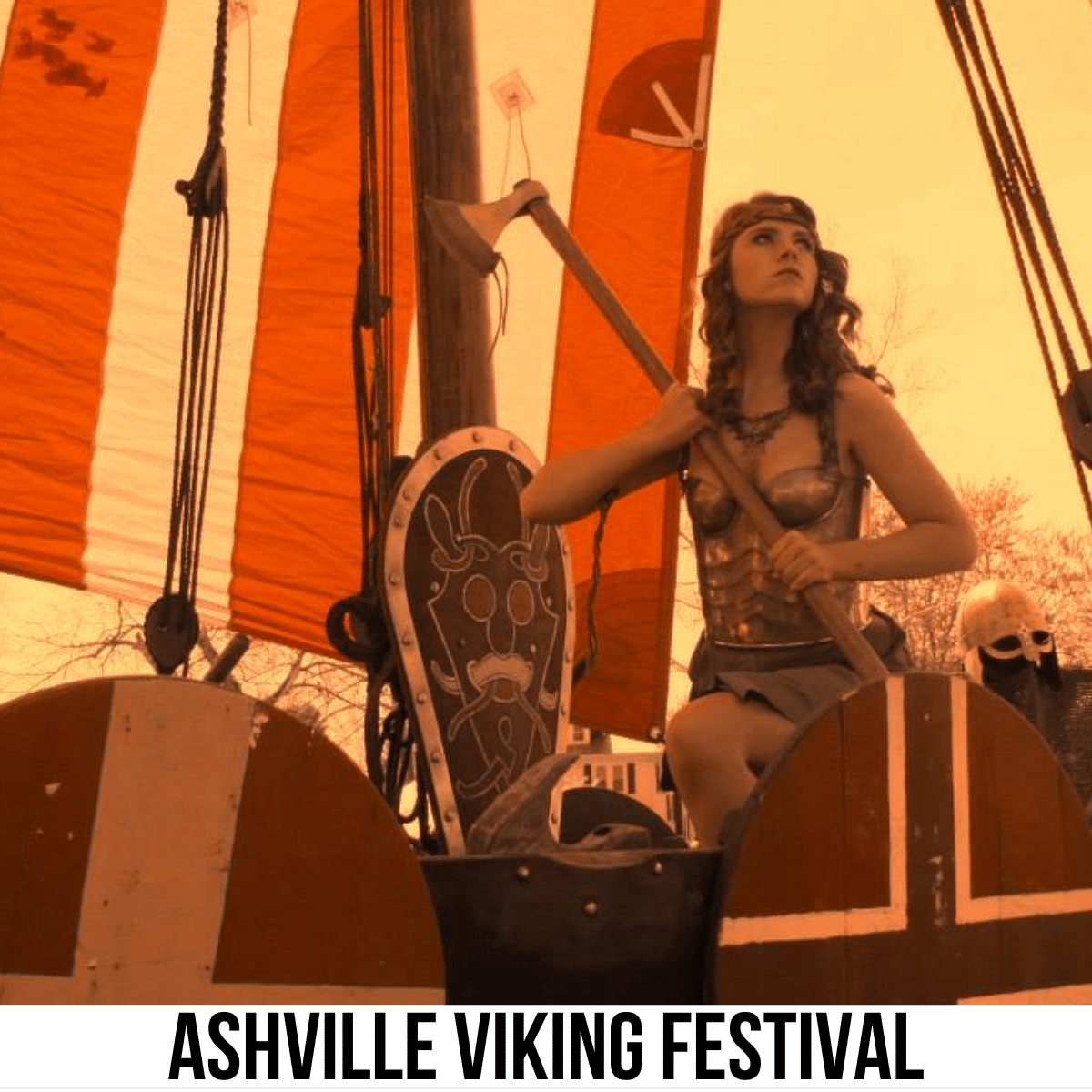 A square image with a photo of a woman in a viking costume holding an axe. A shield is next to her and a red and white flag is hanging behind her. A white strip across the bottom has text Ashville Viking Festival