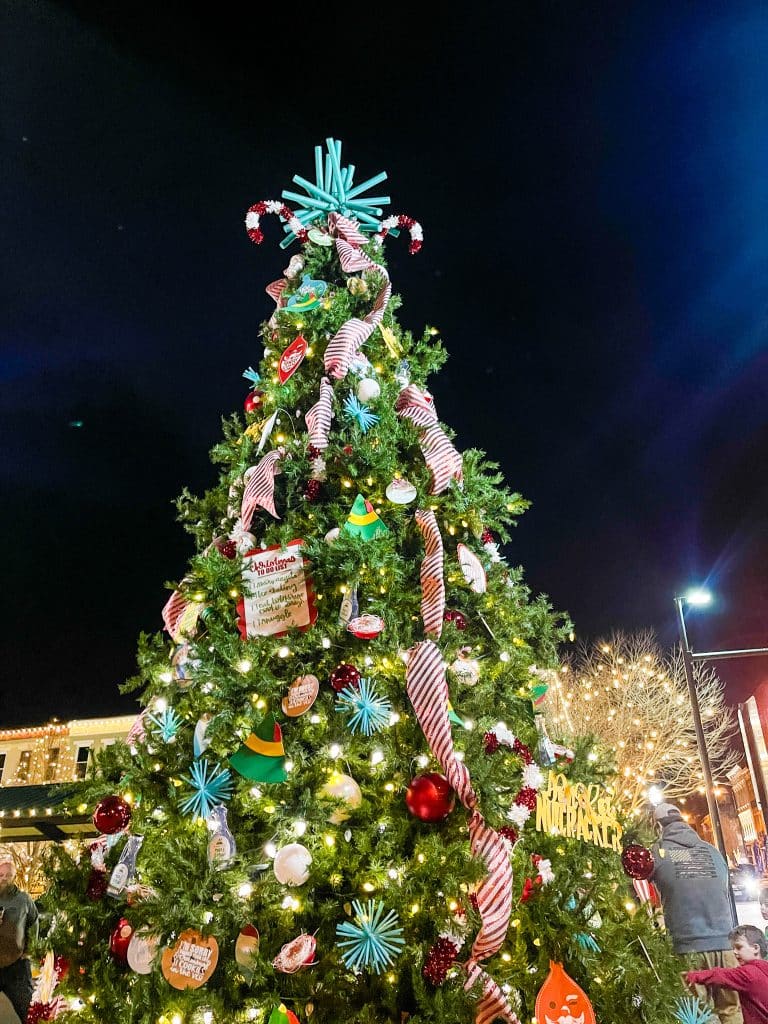 vertical photo of the decorated and lit Christmas tree at the Winterfest, Portsmouth. Photo credit: Cindy Gordon of VisitOhioToday.com