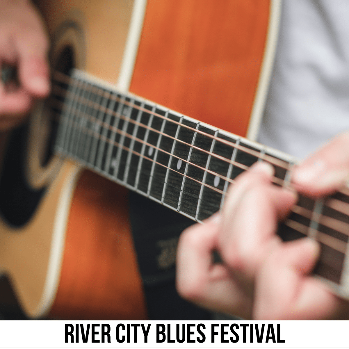 square image with a photo of a guitar player showing only the guitar and hands. A white strip across the bottom has the text River City Blues Festival