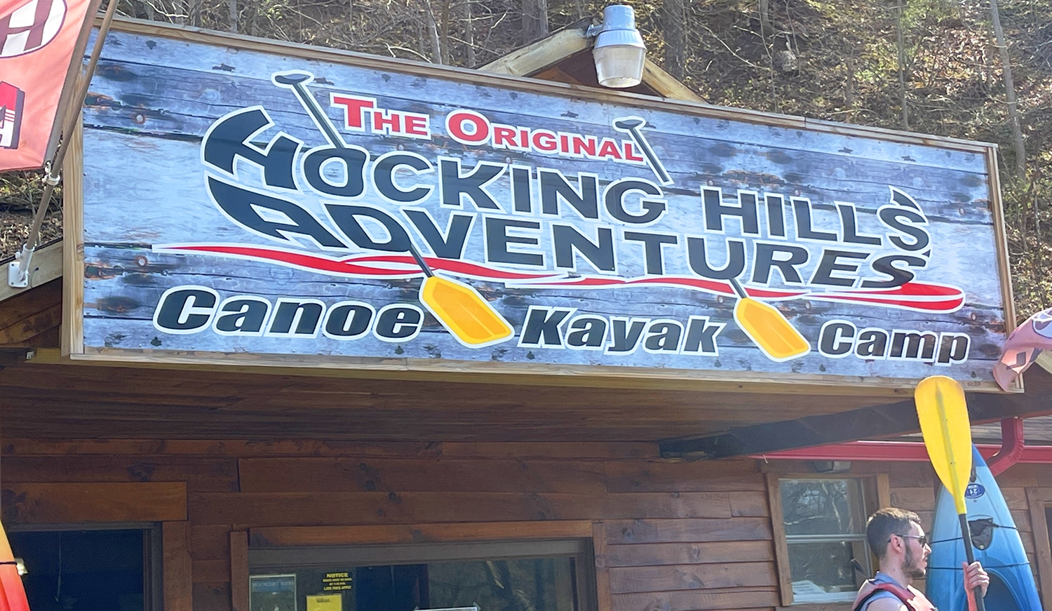 horizontal photo of the sign above the building at Hocking Hills Adventures. Photo credit: Cindy Gordon of VisitOhioToday.com