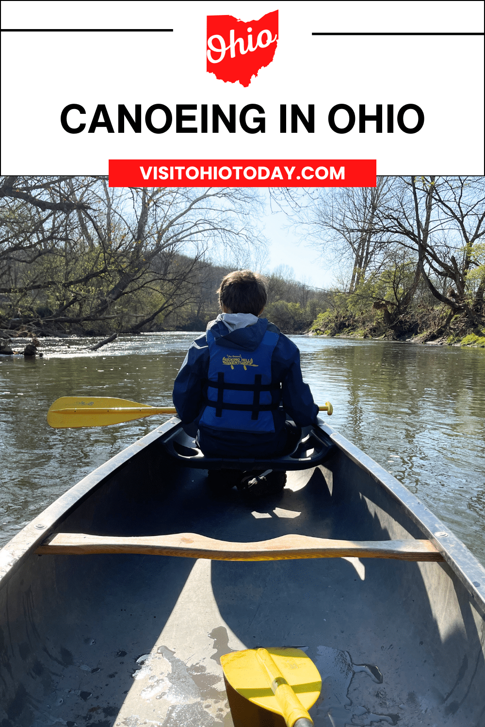 vertical image with a photo of a boy in a canoe on the river. Photo credit: Cindy Gordon of VisitOhioToday.com