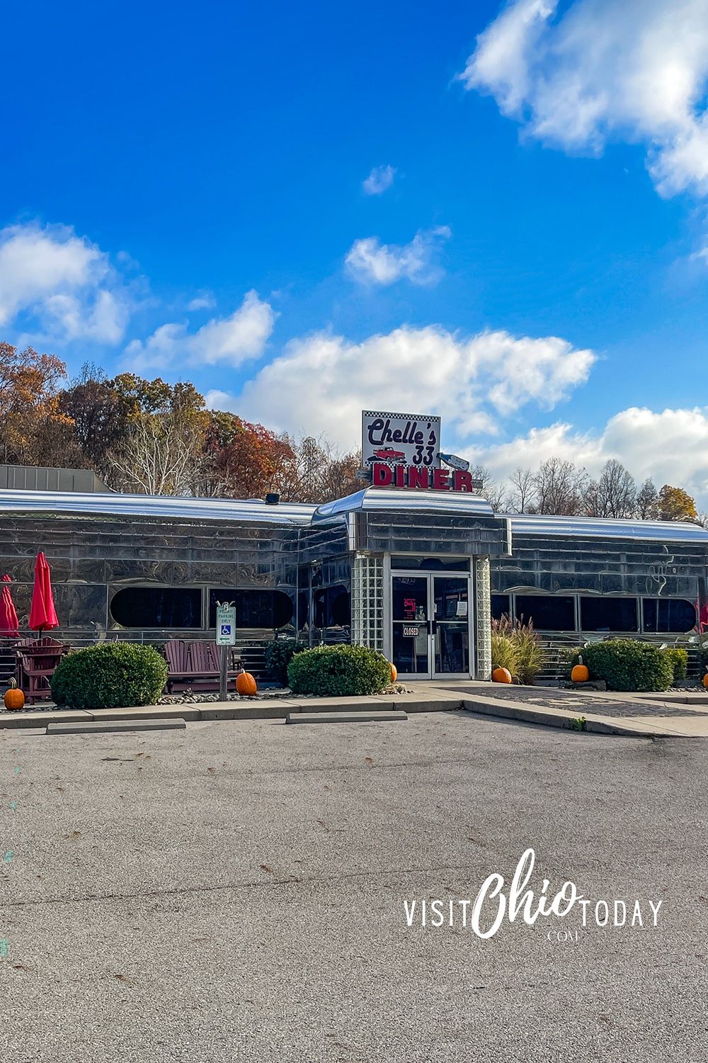 vertical photo of the entrance to Chelles 33 Diner showing the drive up to the building and with a blue sky in the background. Photo credit: Cindy Gordon of VisitOhioToday.com