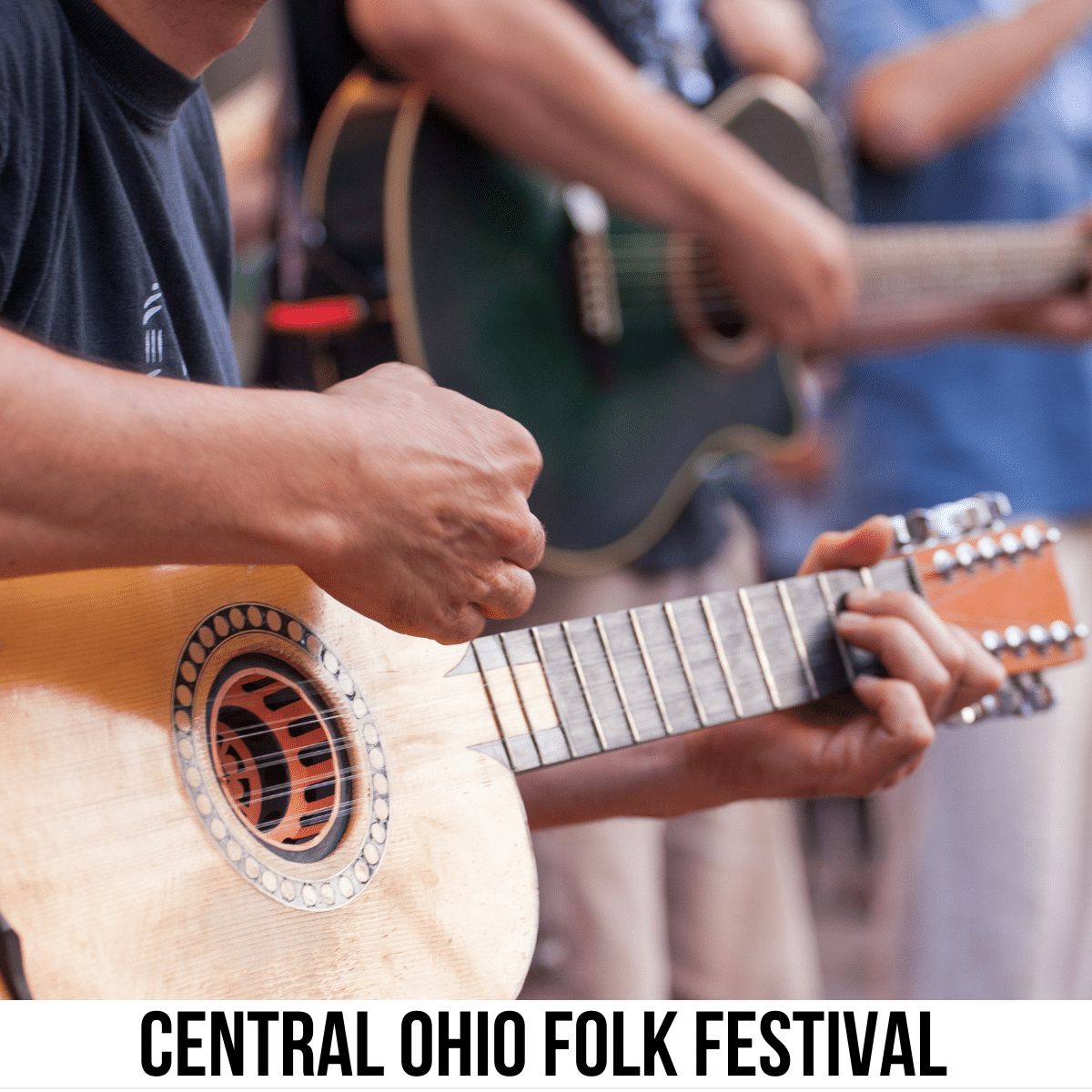 A square image of a photo of a closeup of two people playing acoustic guitars. A white strip across the bottom has text Central Ohio Folk Festival.
