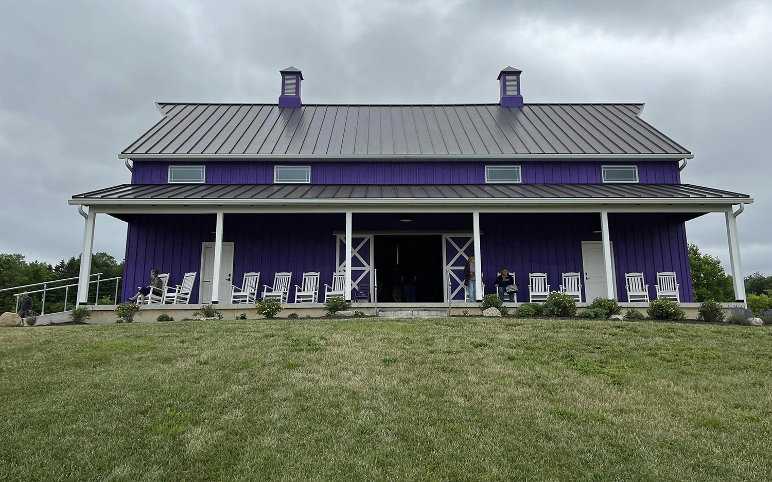 horizontal photo of Sunset Ridge Lavender Farm purple building
