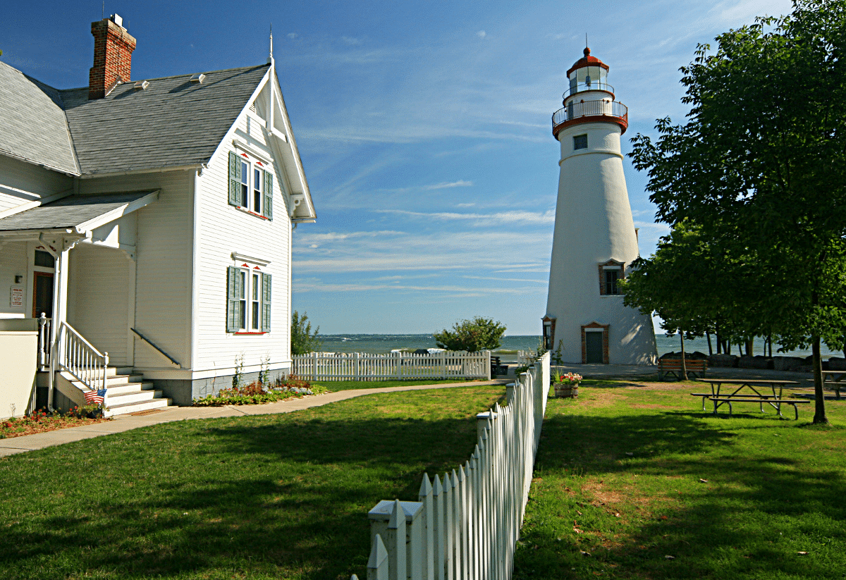 Horizontal photo of Marblehead Lighthouse and the keeper's cottage.