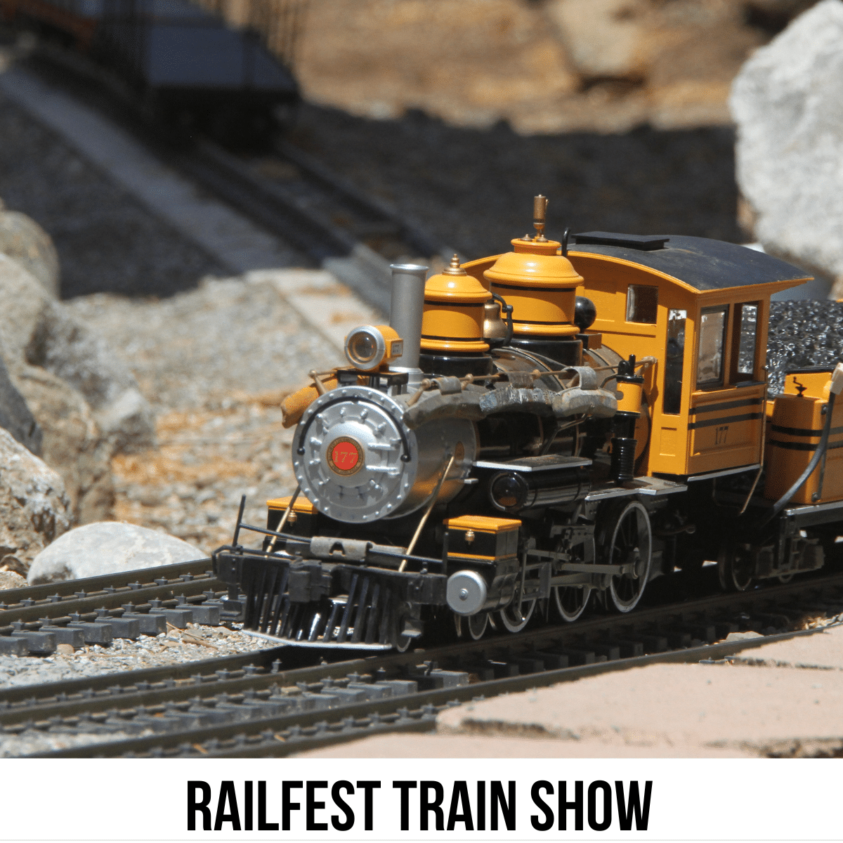 A square image of a photo of a yellow train on a train track. A white strip across the bottom has text Railfest Train Show.