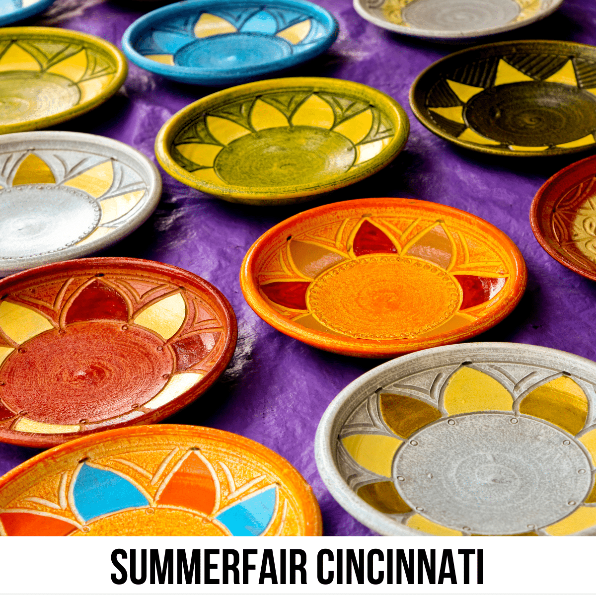 A square image of a photo of several colorful, glazed, ceramic dishes lined up on a table, covered in a purple tablecloth. A white strip across the bottom has text Summerfair Cincinnati.