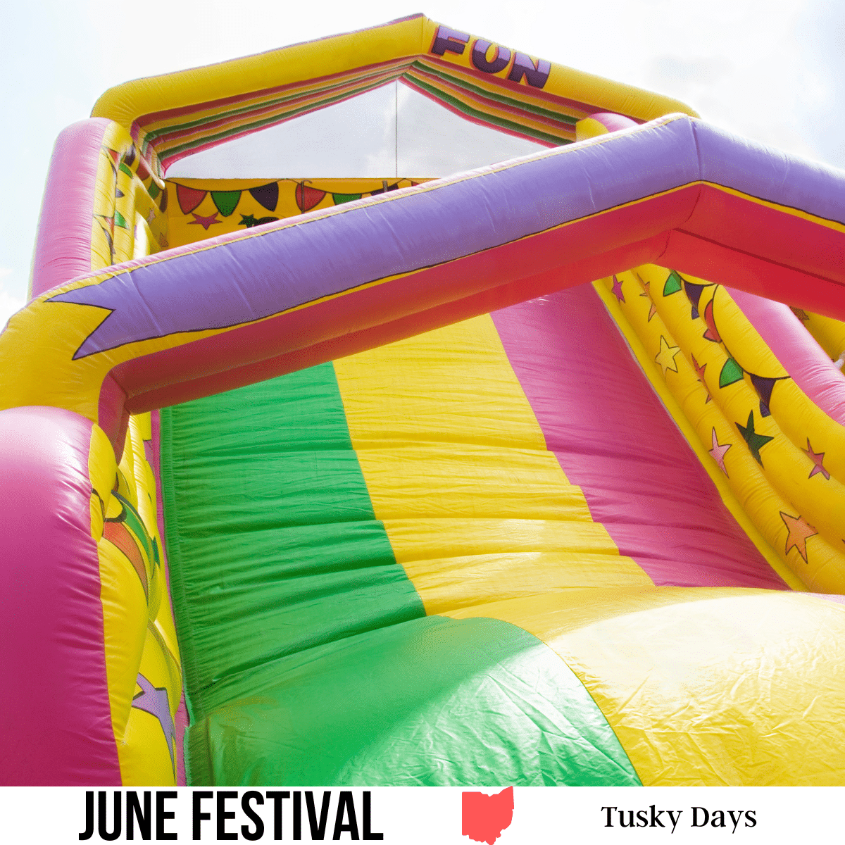 A square image of a photo of an inflatable slide. A white strip across the bottom has text June Festival Tusky Days.