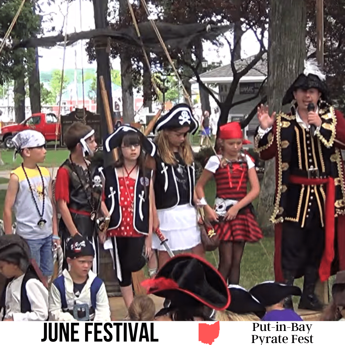 A square image of a photo of several kids dressed up as pirates standing next to an adult dressed up as well, on a stage. A white strip across the bottom has text June Festival Put-in-Bay Pyrate Fest.