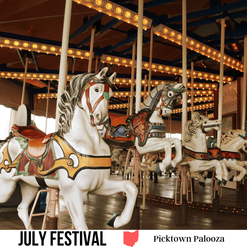 A square image of a photo of carousel horses on a carousel. A white strip across the bottom has text July Festival Picktown Palooza.