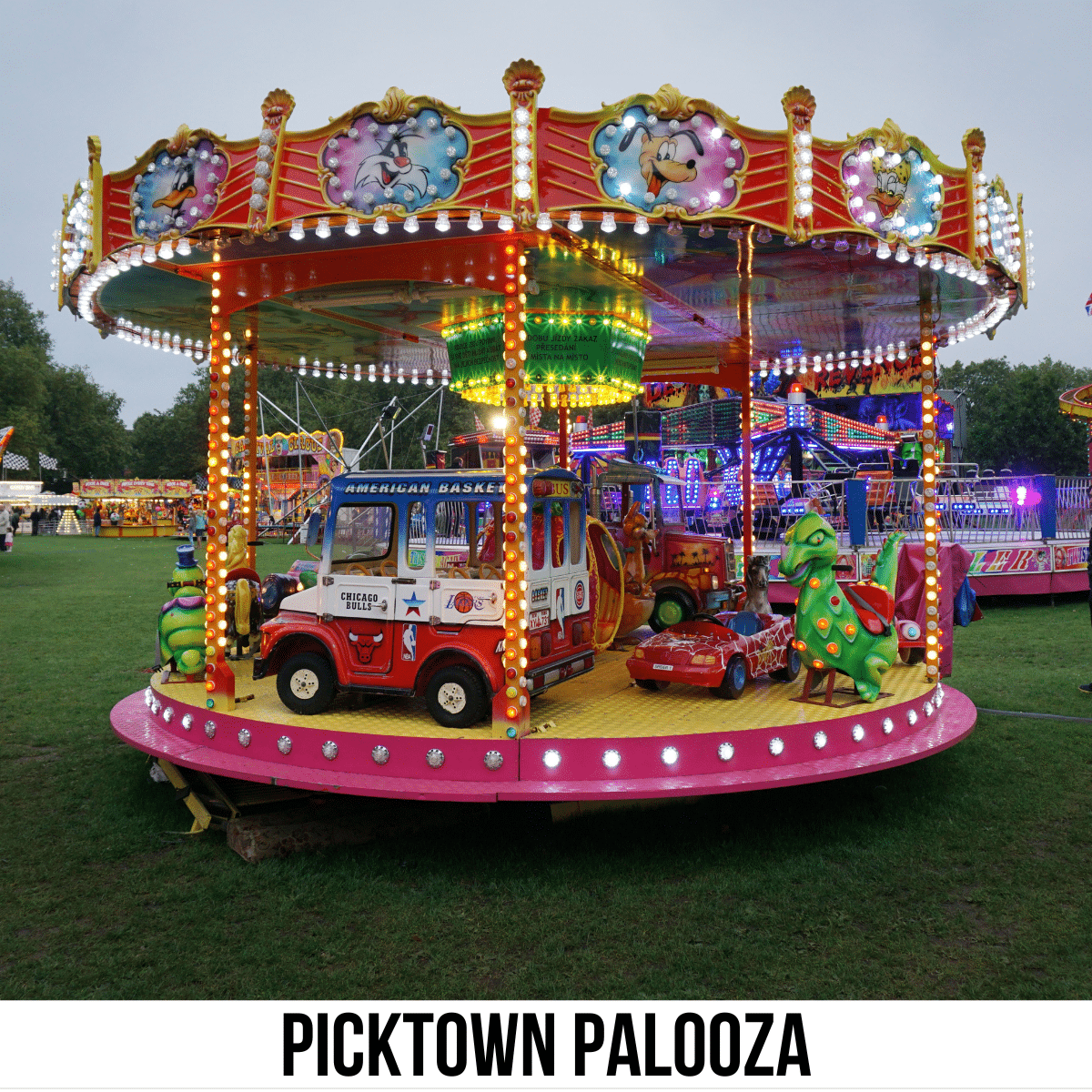 A square image of a photo of a small carnival carousel. A white strip across the bottom has text Picktown Palooza.