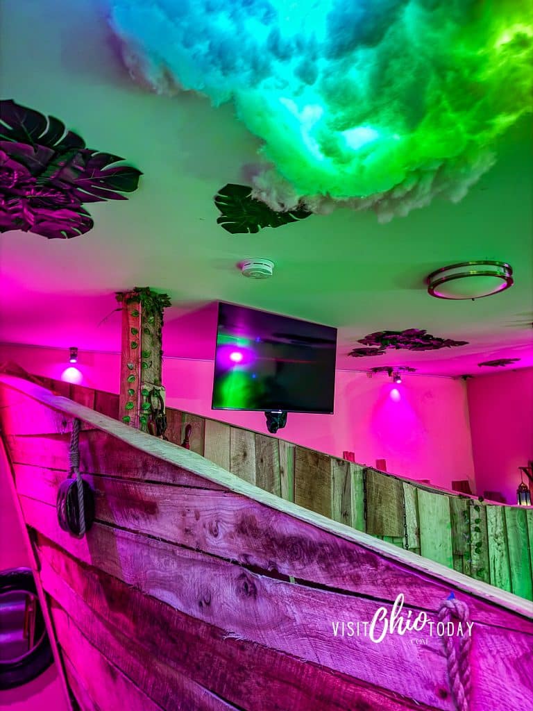 pirate ship bed with fake clouds on ceiling and tv