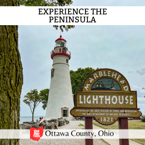 square image with a photo of Marblehead Lighthouse with the historical marker in the foreground. A white strip across the top has the text Experience the Peninsula, and a white strip across the bottom has the text Ottawa County Ohio