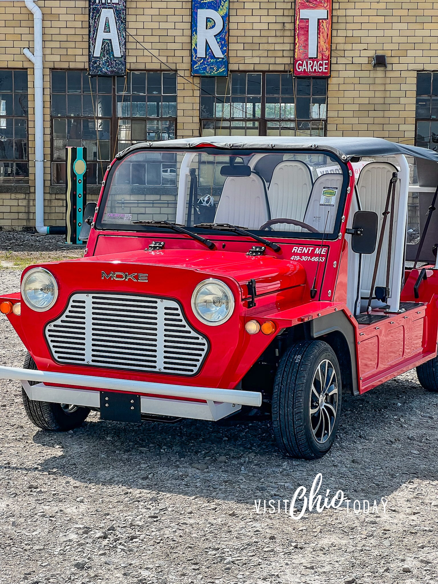 vertical photo of a red Moke small car. Photo credit: Cindy Gordon of VisitOhioToday.com