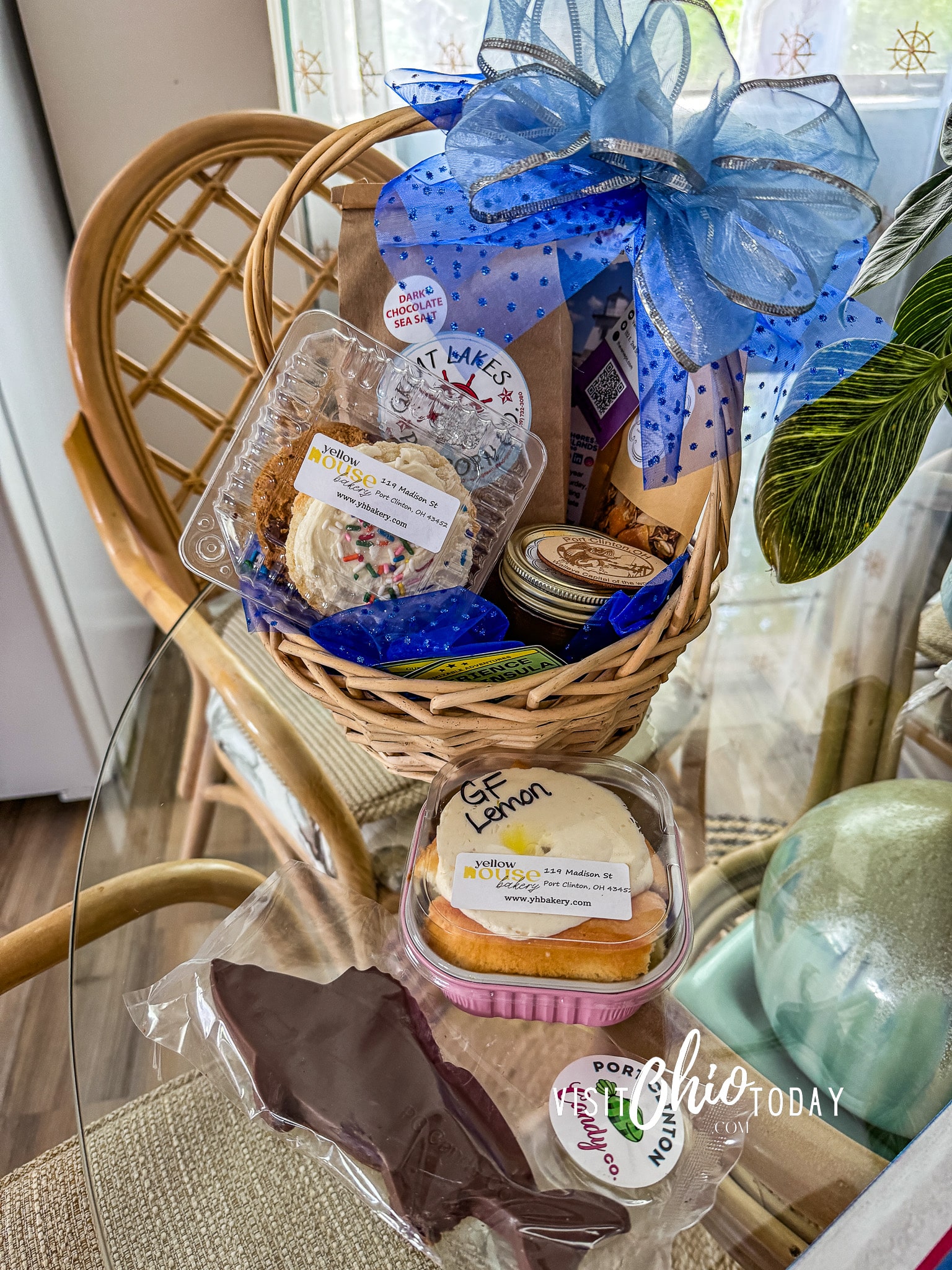 vertical photo of a gift basket showing all the contents, with a large blue bow. Photo credit: Cindy Gordon of VisitOhioToday.com