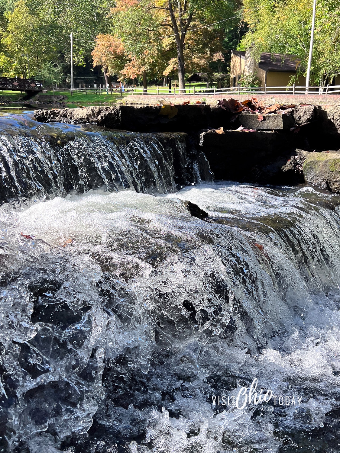 vertical photo of the waterfall at Yellow Creek Park. Photo credit: Cindy Gordon of VisitOhioToday.com