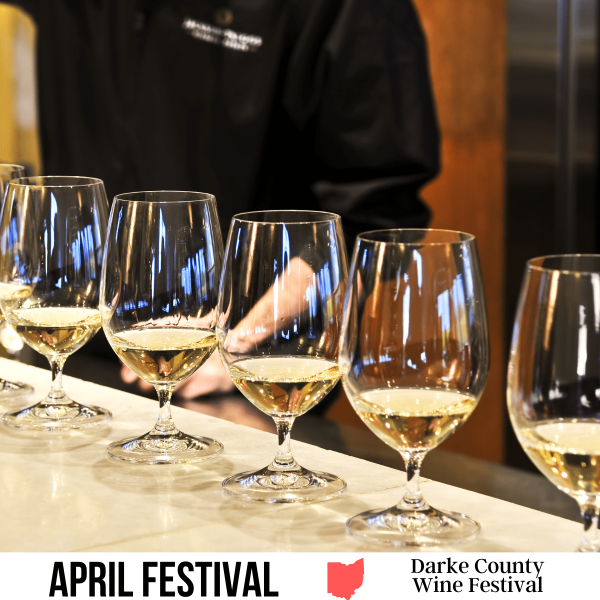 square image with a photo of a wine tasting flight of white wines. A white strip across the bottom has the text April Festival. Darke County Wine Festival