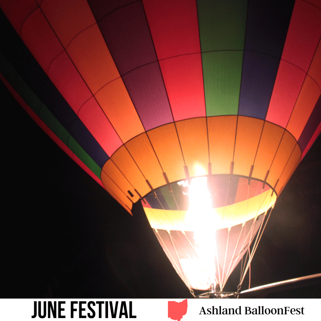 square image with a photo of a lit hot air balloon against a dark night sky. A white strip across the bottom has the text June Festival. Ashland BalloonFest