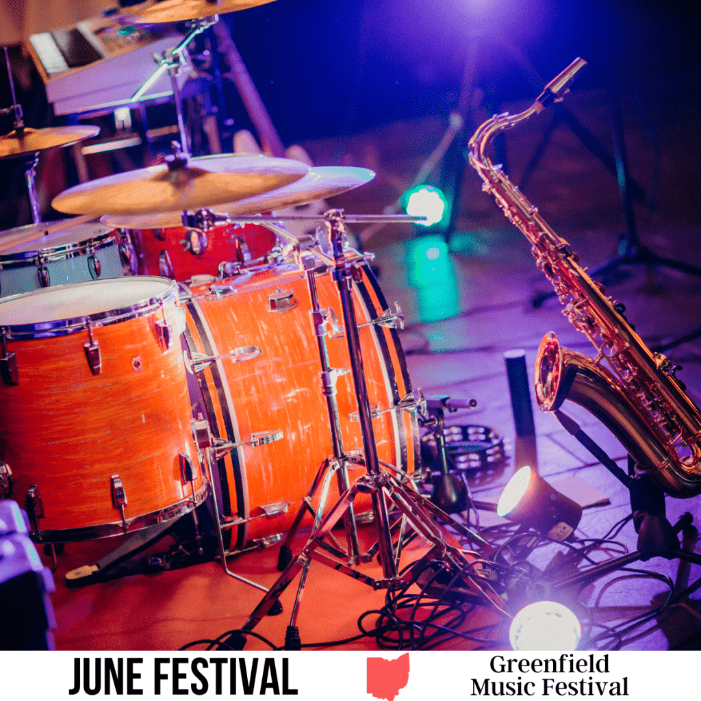 square image with a photo of musical instruments on a stage. A white strip across the bottom has the text June Festival. Greenfield Music Festival