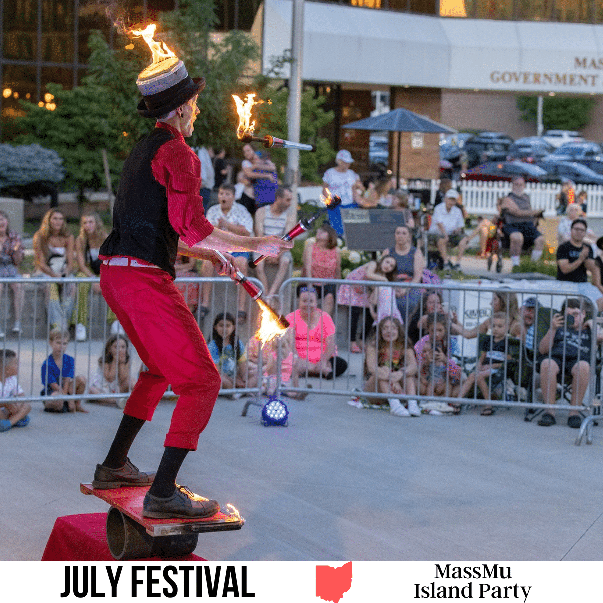 square image with a photo of a fire juggler at the event. A white strip across the bottom has the text July Festival. Massmu Island Party