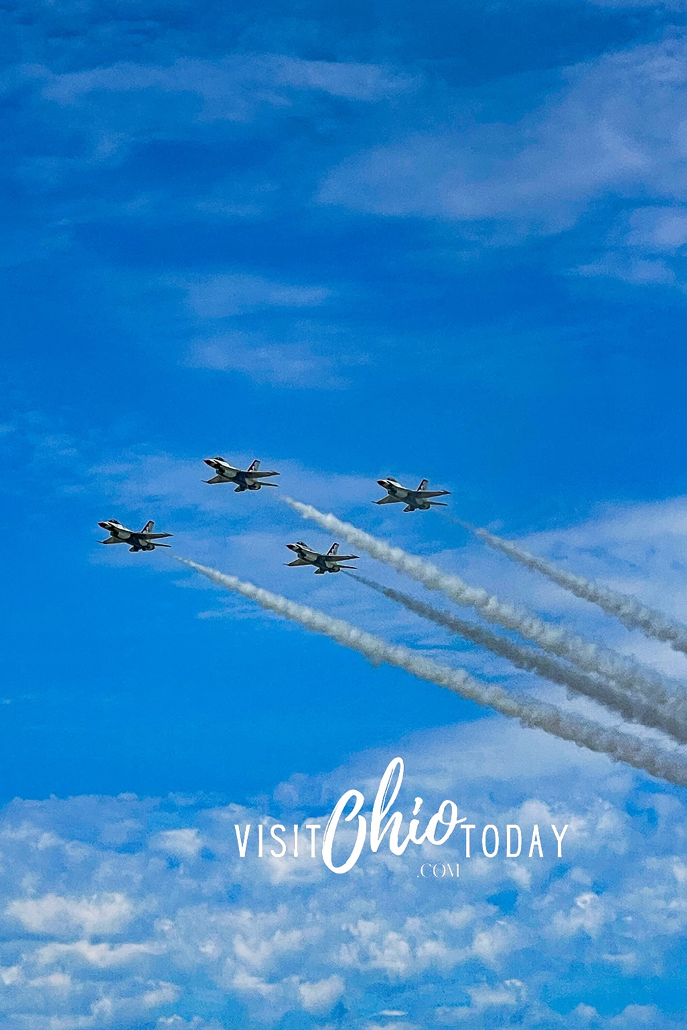 vertical photo of an aerobatic team in the air at the Cleveland National Air Show. Photo credit: Cindy Gordon of VisitOhioToday.com