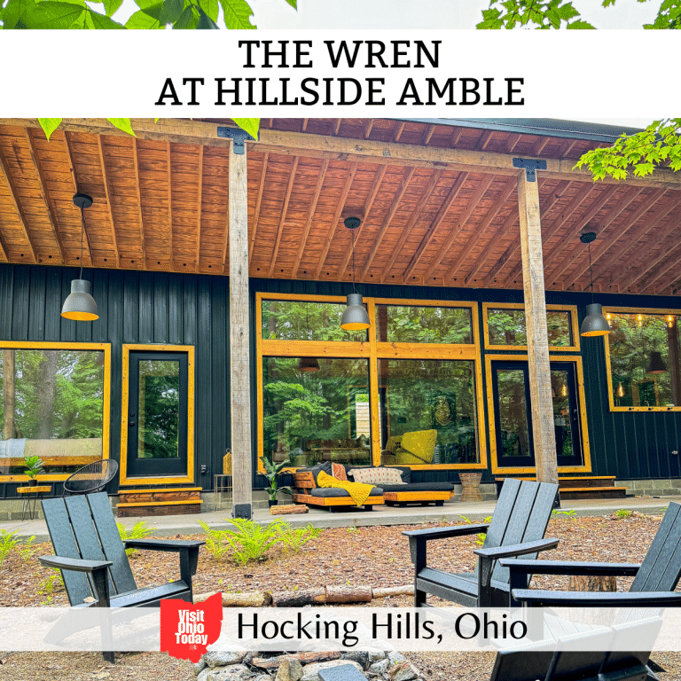 square image with a photo of the outside of the Wren and the patio area. A white strip across the top has the text The Wren at Hillside Amble, and a white strip across the bottom has the text Hocking Hills, Ohio
