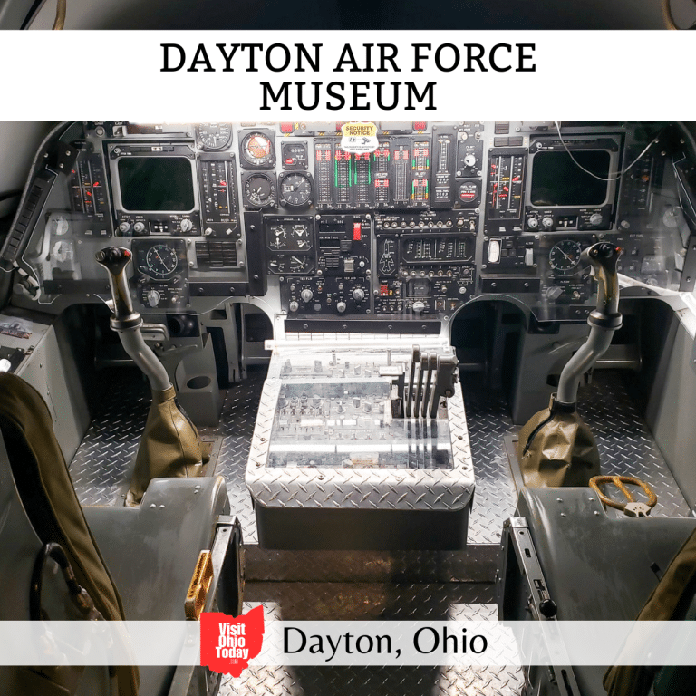 square image with a photo of the inside of a US Air Force plane cockpit. A white strip across the top has the text Dayton Air Force Museum. A white strip across the bottom has the text Dayton, Ohio
