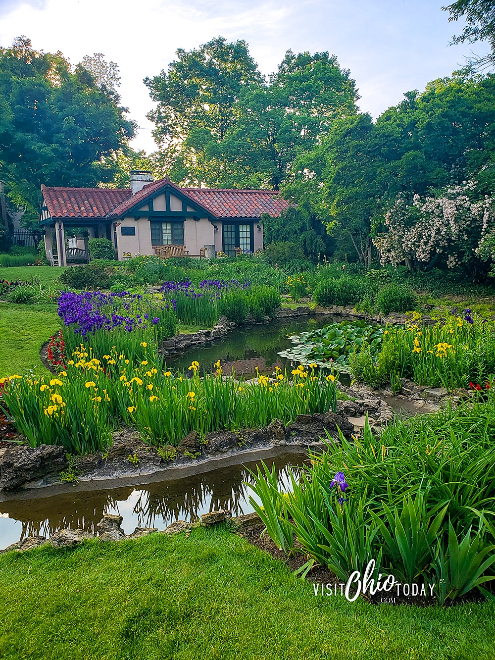 vertical photo of the house and gardens at Smith Memorial Gardens