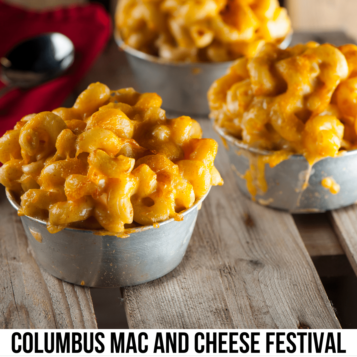 square image with a photo of three small bowls of mac and cheese on a wooden surface. A white strip across the bottom has the text Columbus Mac and Cheese Festival