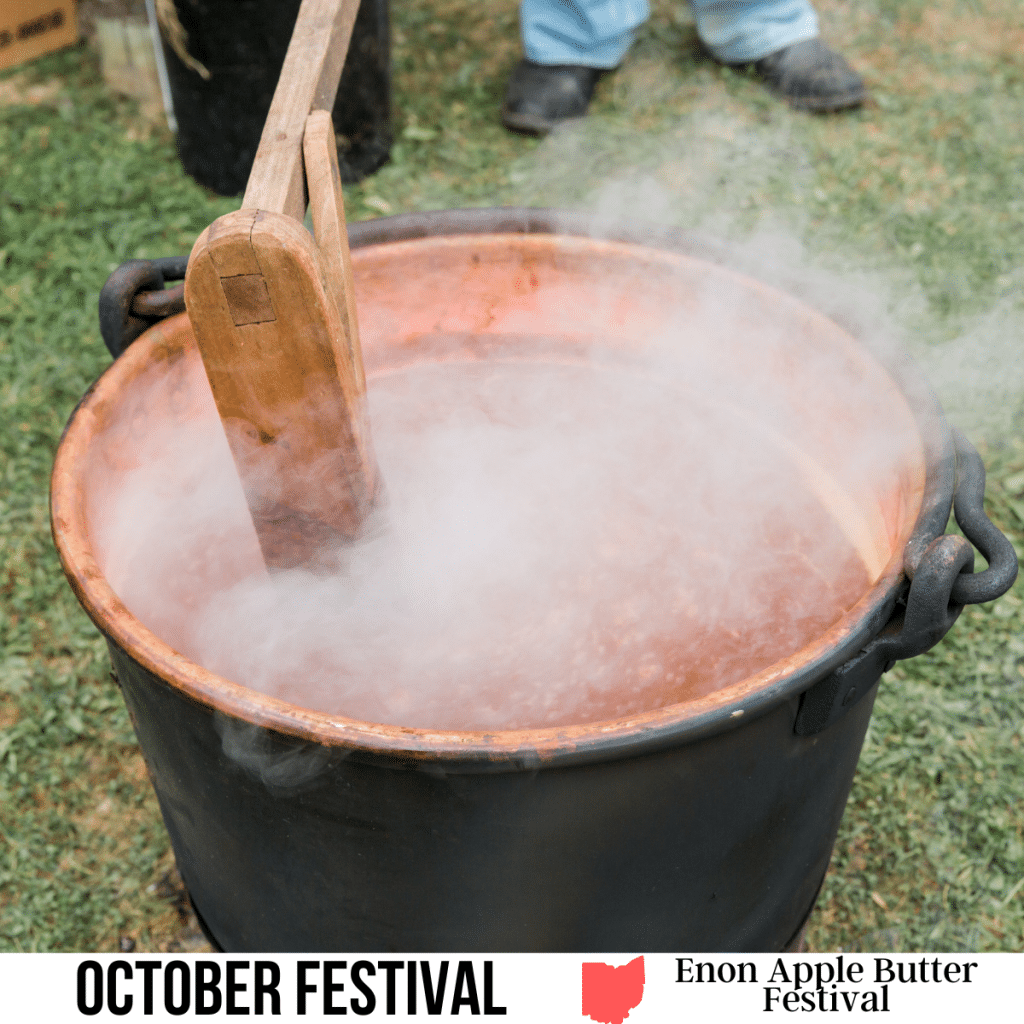 square image with a photo of Apple Butter being stirred in a copper pot over and open fire. A white strip across the bottom has the text October Festival, Enon Apple Butter Festival