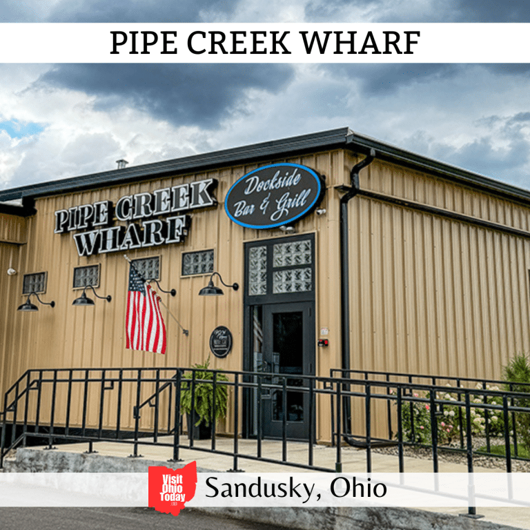 square image with a photo of the outside of the eatery. A white strip across the top has the text Pipe Creek Wharf, and a white strip across the bottom has the text Sandusky, Ohio