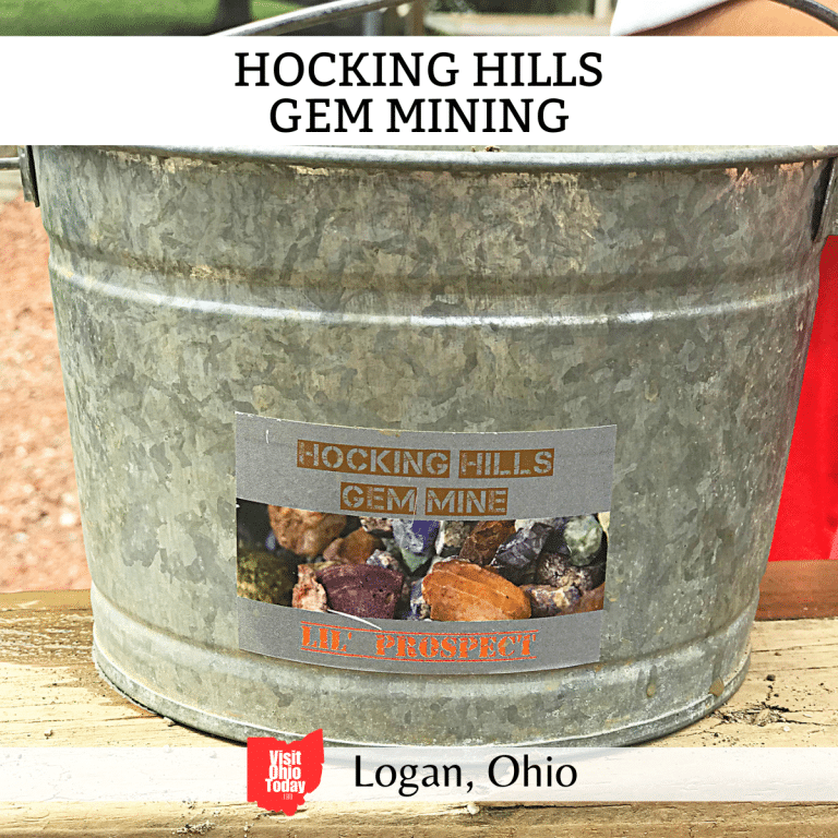 square image with a photo of a mining bucket. A white strip across the top has the text Hocking Hills Gem Mining, and a white strip across the bottom has the text Logan, Ohio