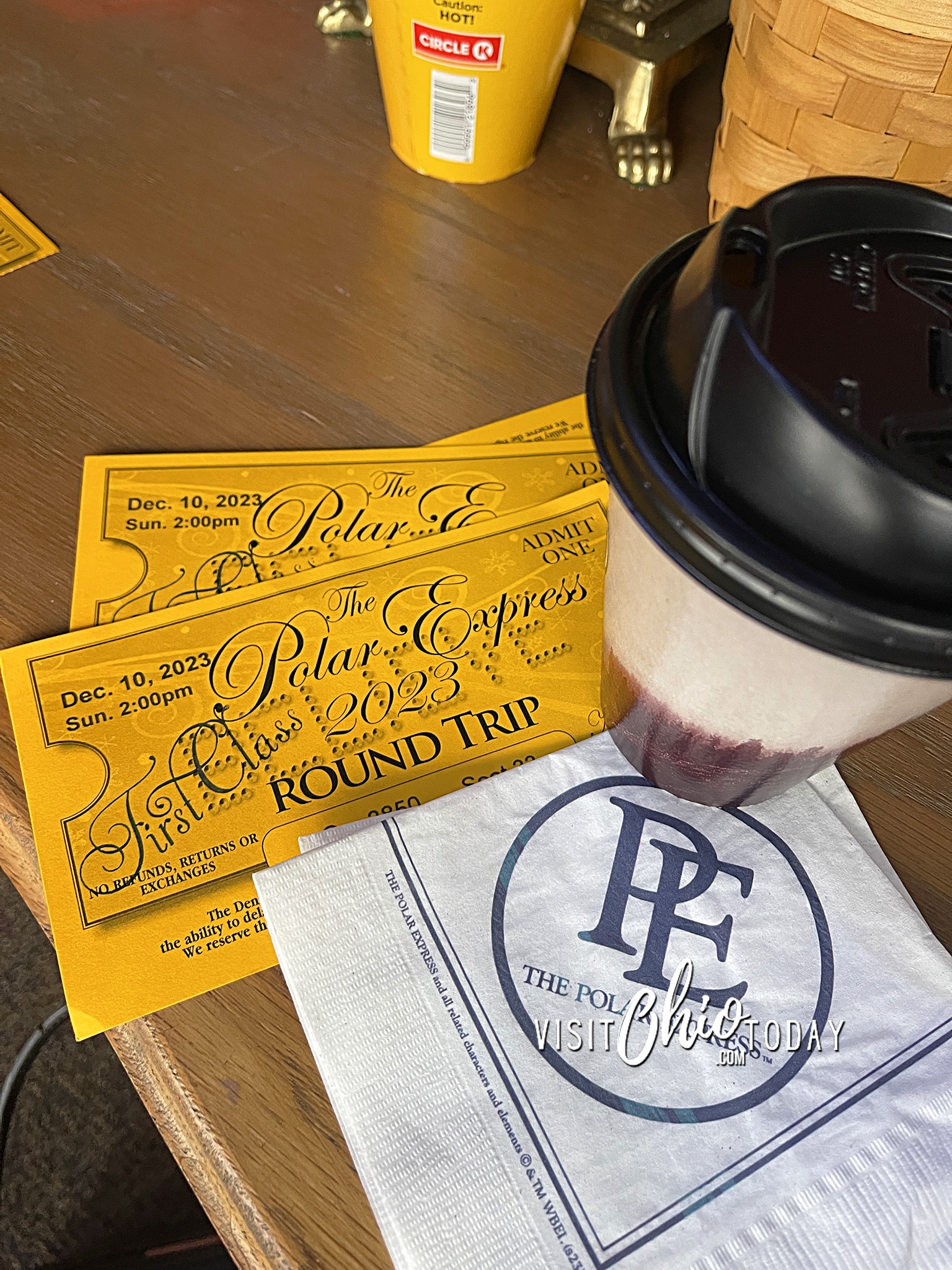 vertical photo of the Polar Express golden tickets on a wooden surface. Photo credit: Cindy Gordon of VisitOhioToday.com